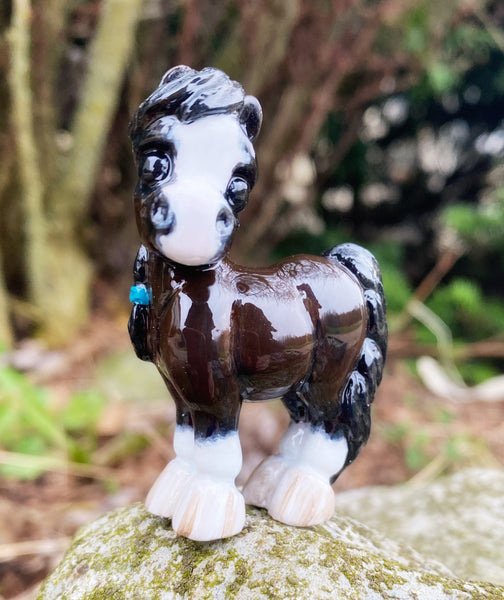 Bay Pony with braids