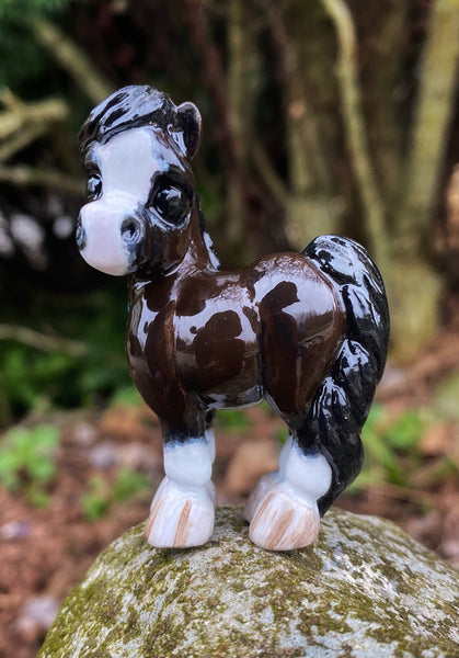 Bay Pony with braids